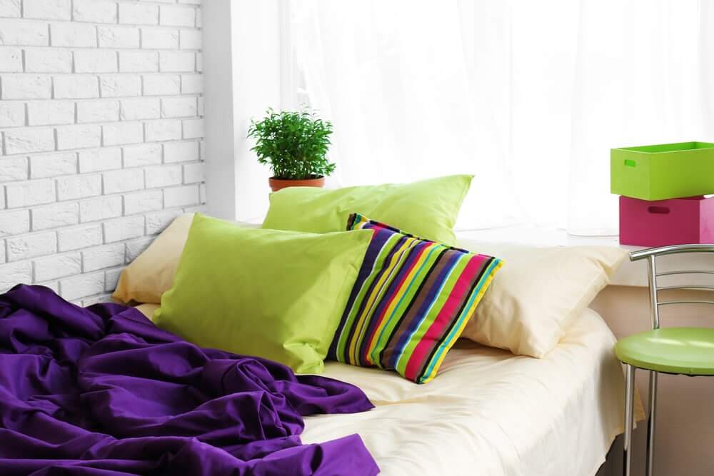 Colourful bed with cushions