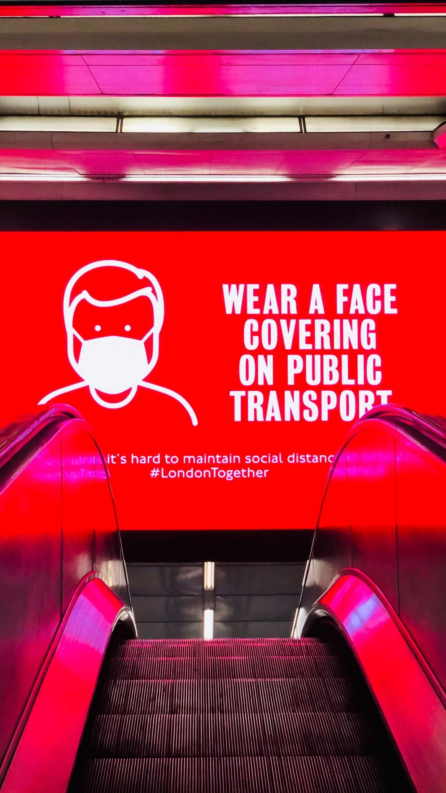 Advert for wearing mask on escalator