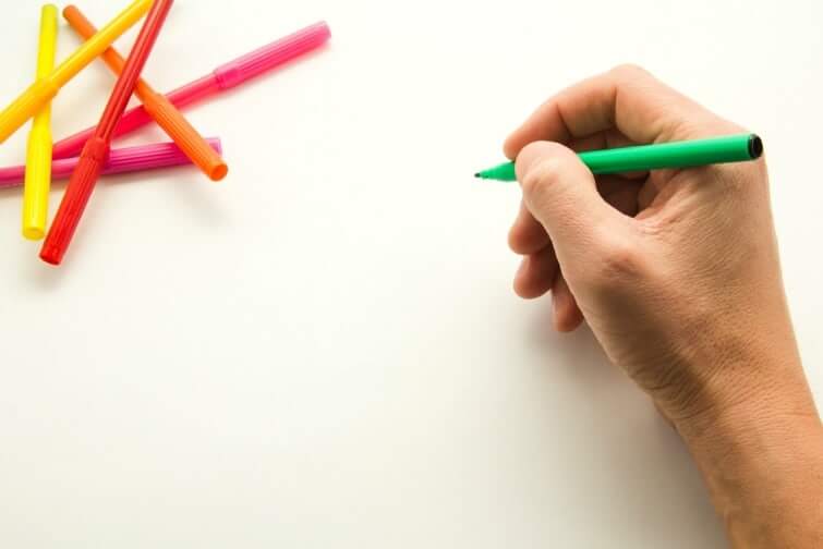 Image of someone doodling, trying to find inspiration